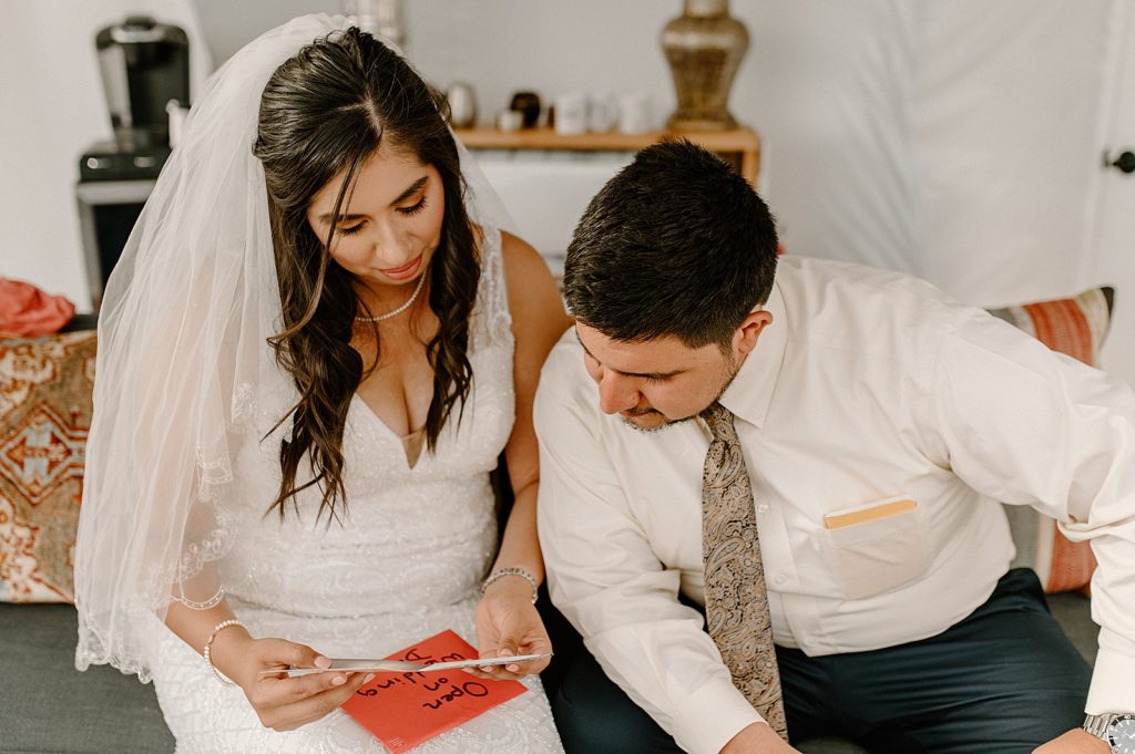 Bride and Groom reading letter together
