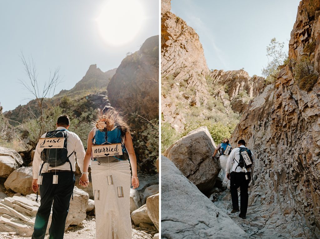 Bride and Groom hiking with "Just married" signs on their backpacks