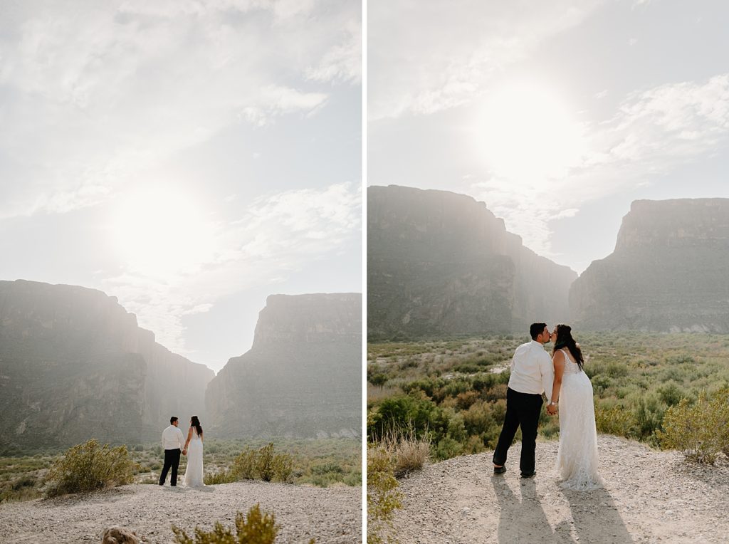 Wide shot of Bride and Groom kissing in front of canyon