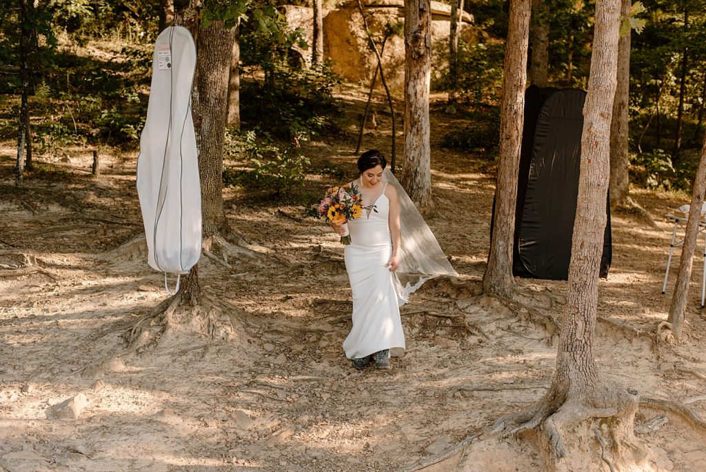 Bride walking during outdoor forest Ceremony