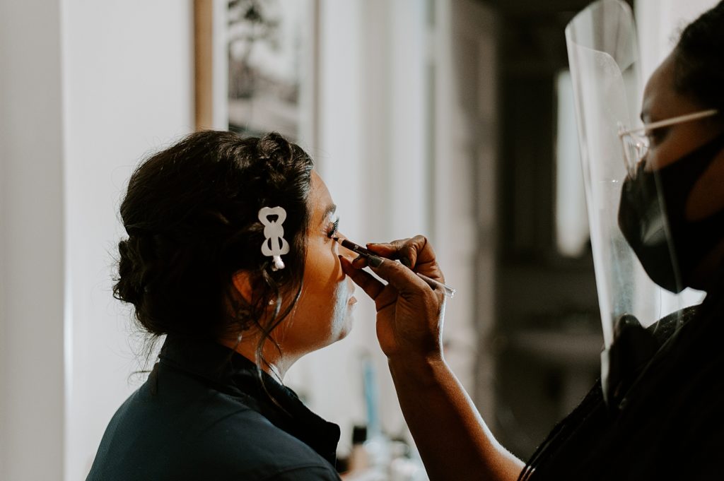 Makeup artist doing Bride's makeup