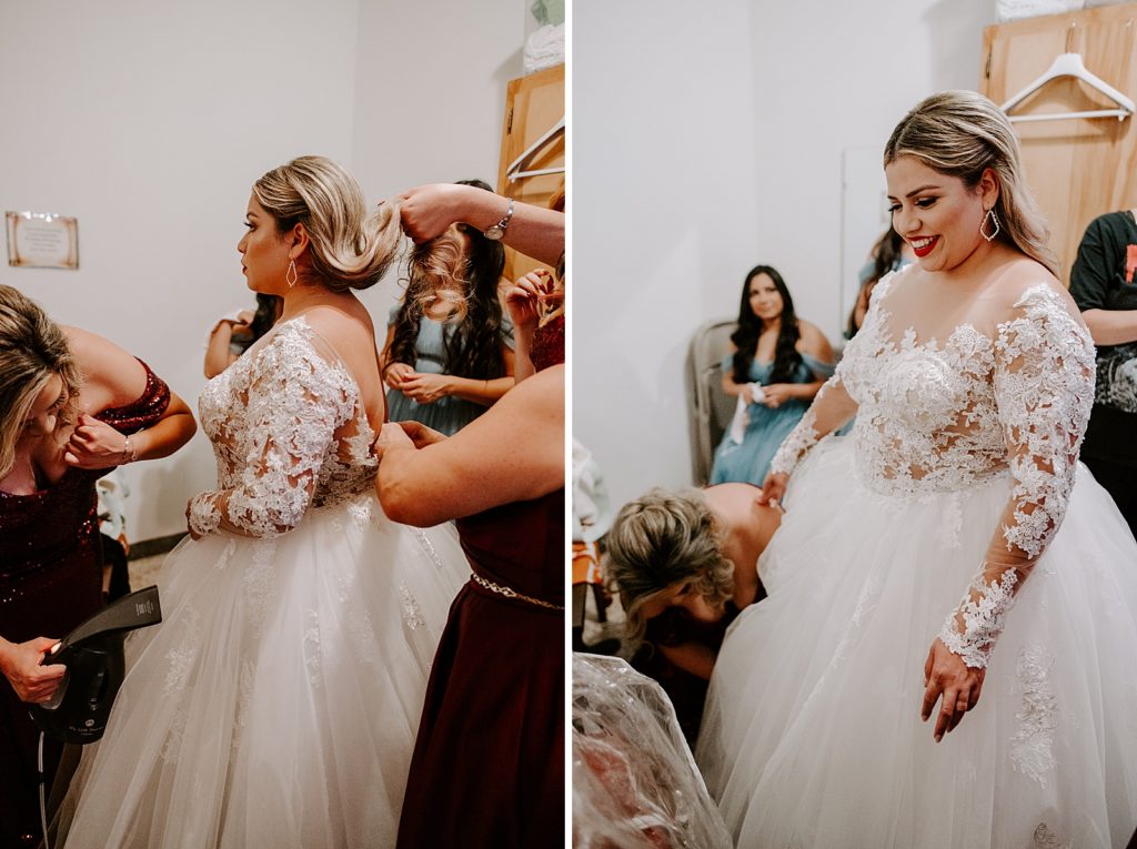 Bride getting help to put on Wedding dress
