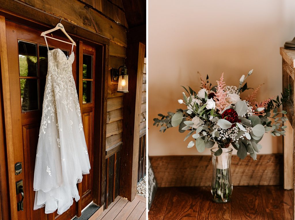 Wedding dress hanging on front door with bouquet in glass vase