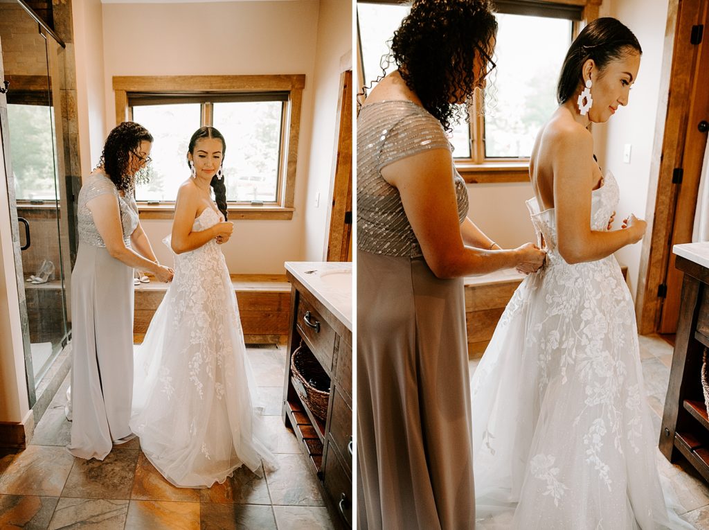 Mother helping Bride buttoning wedding dress Getting Ready