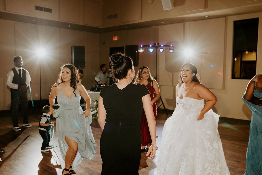 Bride dancing during Reception with guests