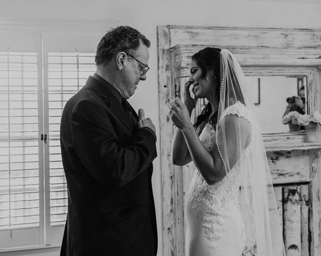 B&W Bride crying with father before Ceremony