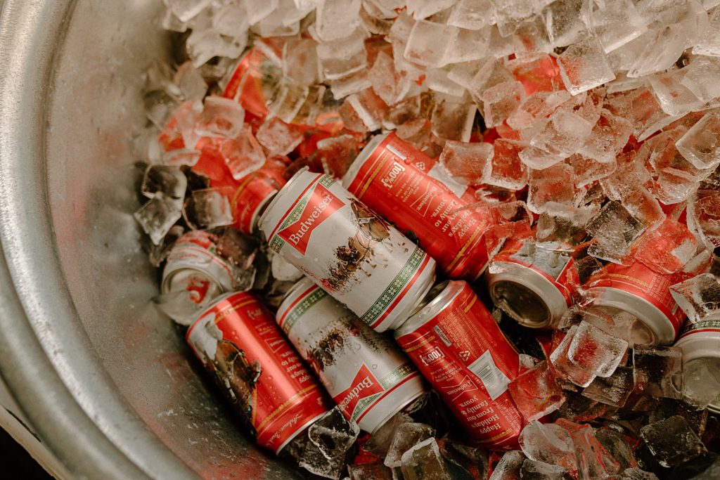 Detail shot of Budweiser cans in ice bucket