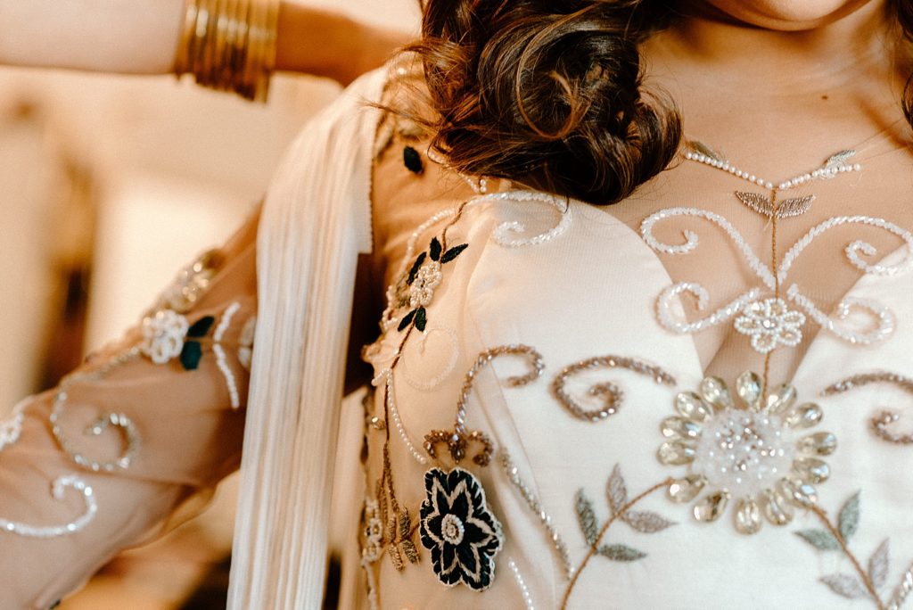 Closeup details of Bride's dress with fun design details