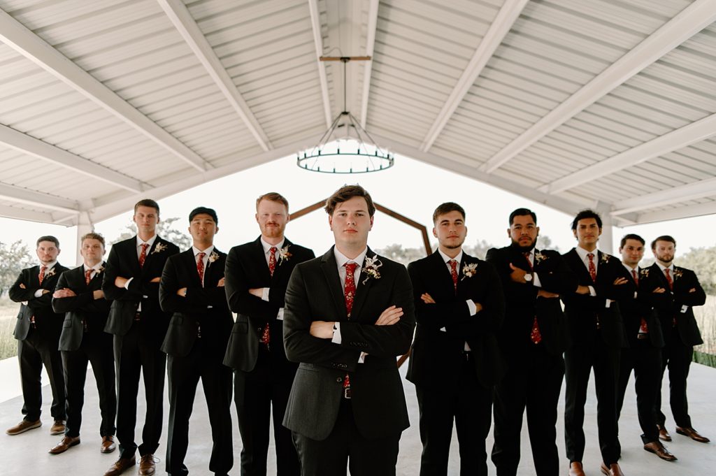 Groom and Groomsmen with arms crossed in triangle formation